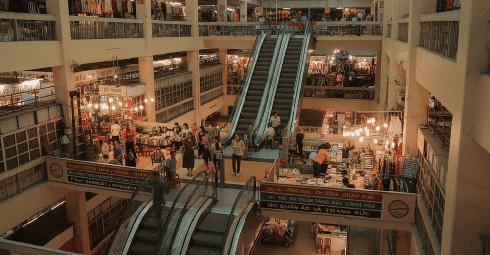 A top-down view of An Dong Market's floors filled with stalls, seen from the central stairway